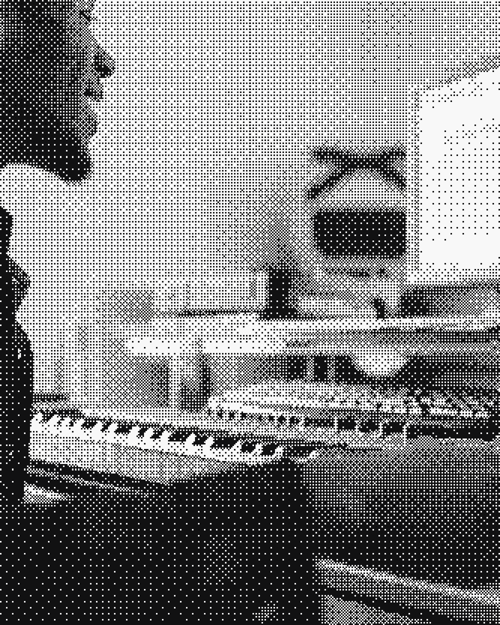 A keyboard and monitors on a desk
