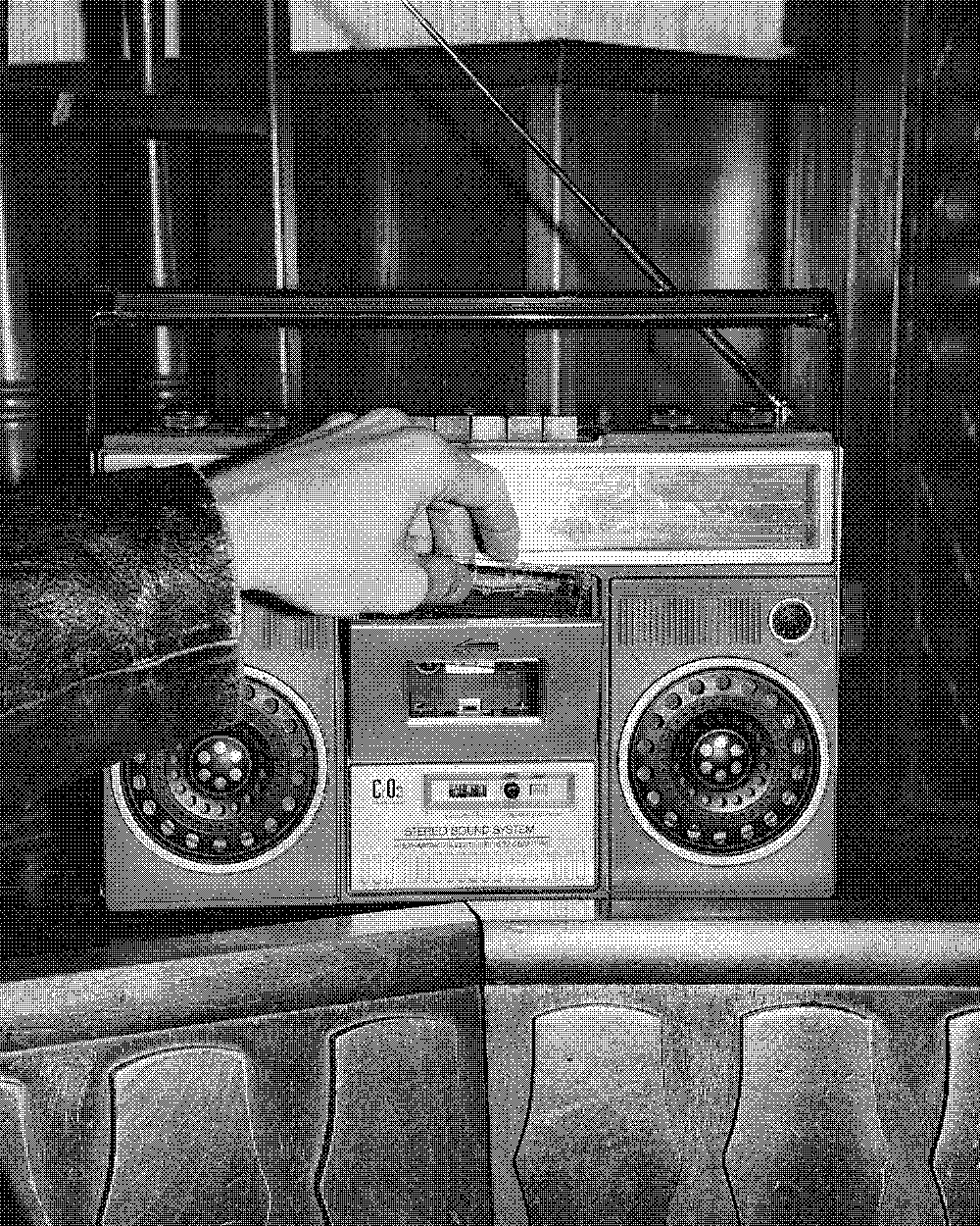 A hand tuning an old radio at the bar